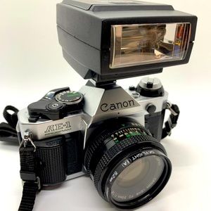 Canon AE-1 Program Film Camera with 50mm f/1.8 FD Lens and a Flash
